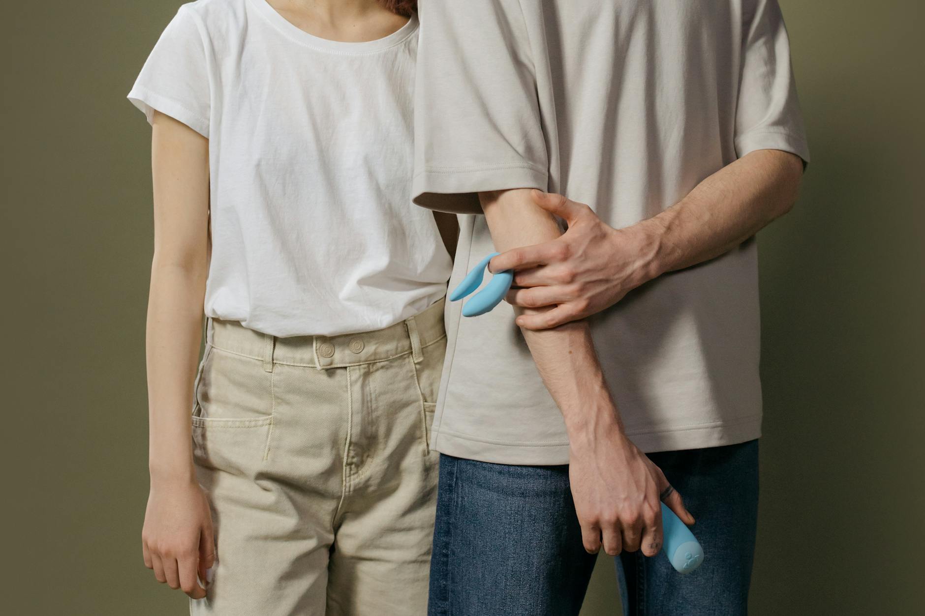 A young couple standing together indoors, reconnecting with physical intimacy